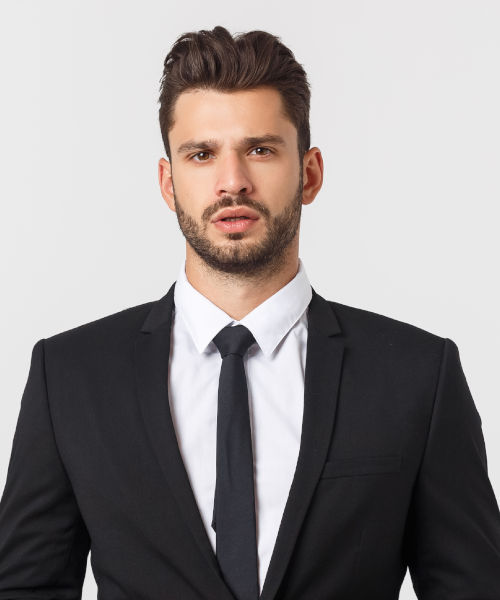 Young man in black suit and tie